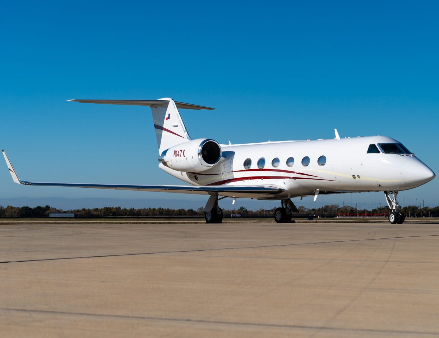 A small white plane sitting on top of an airport runway.