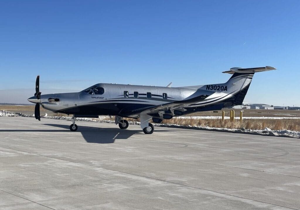 A small airplane sitting on top of an airport runway.