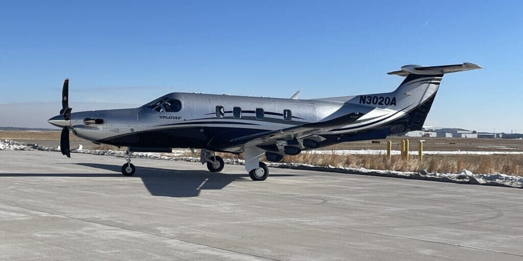 A small airplane sitting on top of an airport runway.